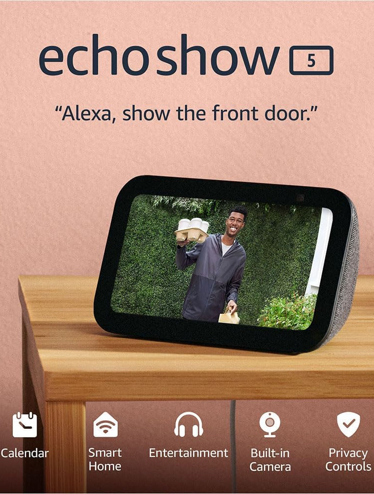 Echo Show 5 device on a wooden surface with a man on the screen and text 'Alexa, show the front door.'